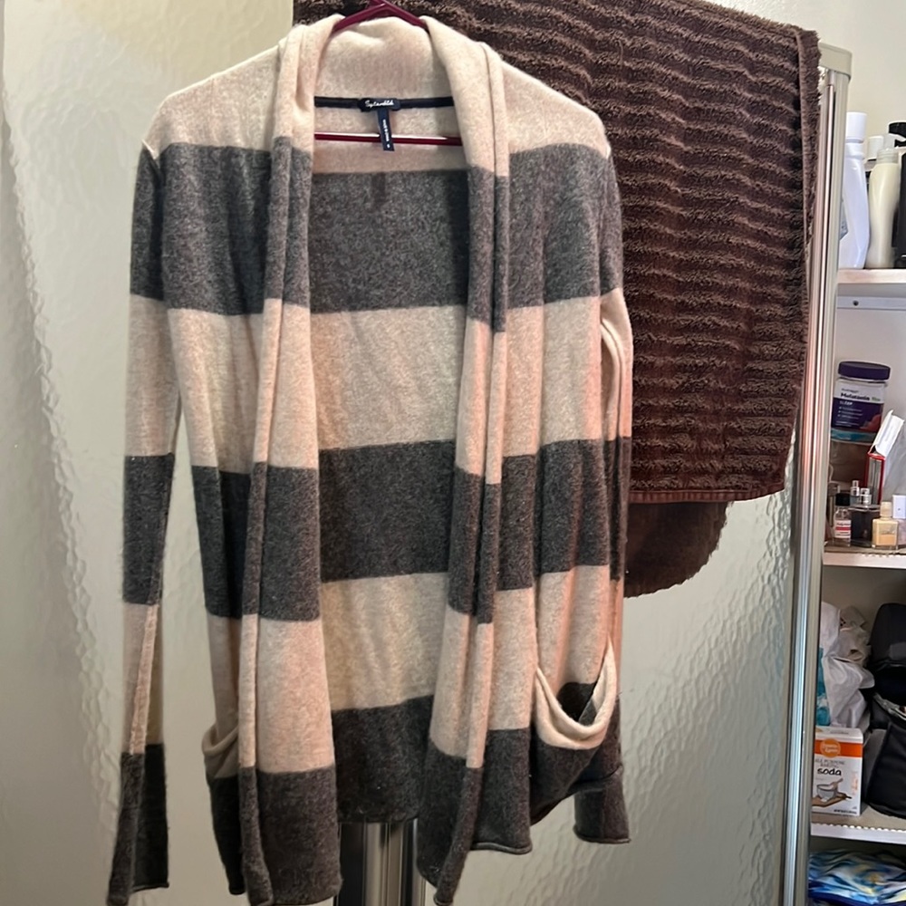 100 percent cashmere sweater. Extremely soft Off white and grey striped.